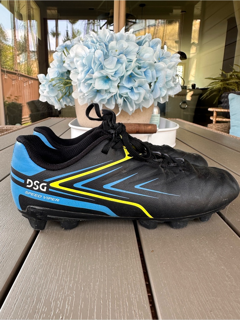 DSG Black Soccer Cleats with Blue and Yellow Accents